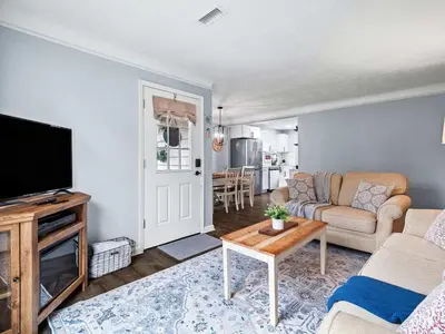 a living room with a couch and a tv at Modern 3Bed Home Near CLE With Private Backyard in Parma Heights
