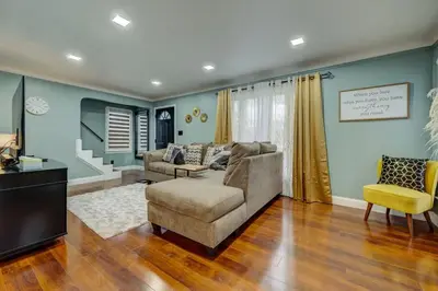 a living room with a couch and a tv at South Euclid Home 10 Minutes to Cleveland Clinic in South Euclid