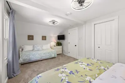 a bedroom with two beds and a window at Renovated and Professionally Designed 3Bed Home in Euclid
