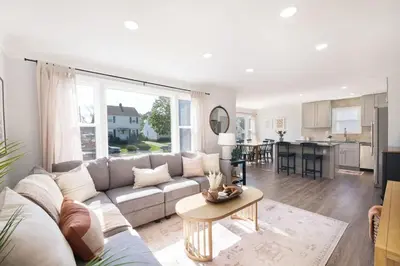 a living room with a couch and a table at Remodeled 4 Bedroom With a Game Room in Parma