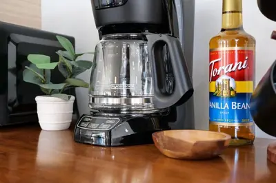 a blender sitting on a table with a wooden bowl at Remodeled 4 Bedroom With a Game Room in Parma