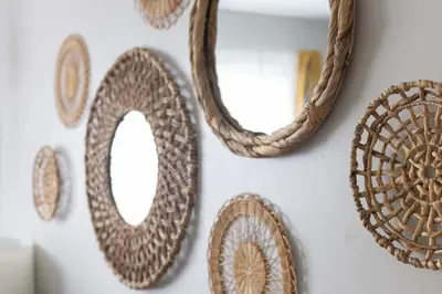 a group of mirrors hanging on a wall at Entire Secluded House Close To CLE Airport and BWU in Strongsville