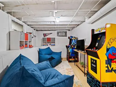 a room with a video game arcade and a game at Game Room 7 Min To Downtown CLE in Cleveland