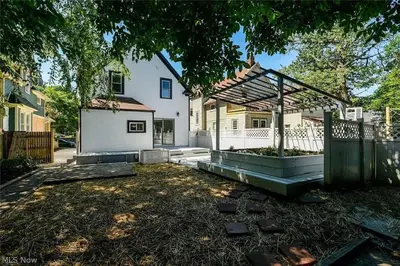 a backyard with a gazebo and a white house at Game Room 7 Min To Downtown CLE in Cleveland
