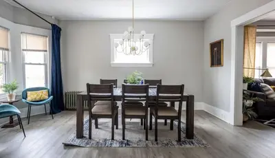 a dining room with a table and chairs at Large Renovated 4 Bedroom Home 9 min to Downtown CLE in Cleveland