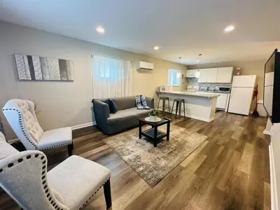 a living room with a couch and a table at Cozy Retreat Apartment in Cincinnati