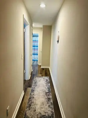 an empty hallway with a rug on the floor at Cozy Retreat Apartment in Cincinnati