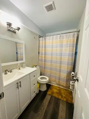 a bathroom with a toilet and a sink at Reading-Stylish Apartment for Contemporary Comfort in Cincinnati