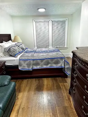 a bedroom with a bed and a window at LOVELY FURNISHED HOUSE FOR rent in Akron