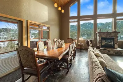 a dining room with a table and a couch at Cozy Rustic Escape Near Park City Adventures in Defiance