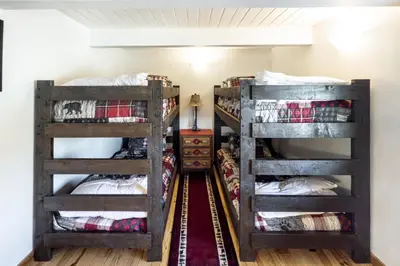 two bunk beds in a room with a hallway at Cozy Rustic Escape Near Park City Adventures in Defiance
