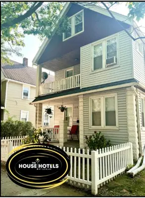 a house with a houston hubris sign in front of it at Lakewood Central Haven in Cleveland