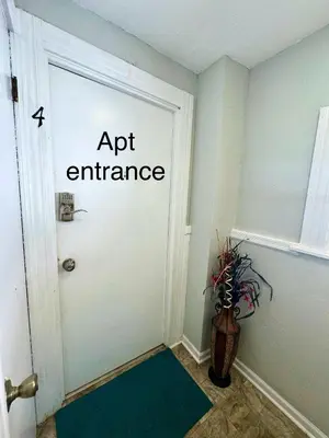 a door with a sign that reads apt entrance at Lakewood Central Haven in Cleveland