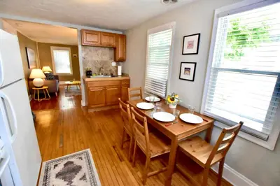 a kitchen and dining room with a table and chairs at Lakewood Central Haven in Cleveland