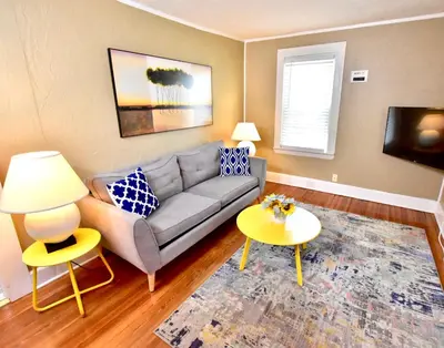 a living room with a couch and a table at Lakewood Central Haven in Cleveland