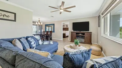 a living room with blue couches and a flat screen tv at BLC200 in Lawrenceburg