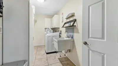 a bathroom with a sink and a washing machine at BLC200 in Lawrenceburg