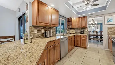 a kitchen with wooden cabinets and a counter top at BLC200 in Lawrenceburg