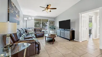 a living room with a couch and a flat screen tv at BLC200 in Lawrenceburg