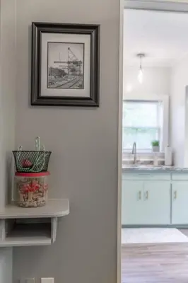 a kitchen with a picture hanging on the wall at Walkable Neighborhood of Kamm's Corners in Cleveland