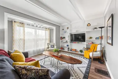a living room with a couch and a table at Double the Space for Large Groups Entire Duplex in Cleveland