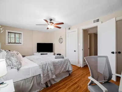 a bedroom with a bed and a ceiling fan at Cleveland 3 Bedroom, 10 Mins to Downtown in Cleveland