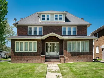 a red brick house with a white door at Cleveland 3 Bedroom, 10 Mins to Downtown in Cleveland