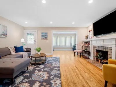 a living room with a couch and a fireplace at Cleveland 3 Bedroom, 10 Mins to Downtown in Cleveland