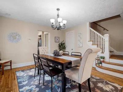 a dining room with a table and chairs at 6 Bedroom Entire Duplex for Large Groups in Cleveland