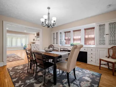a kitchen and dining room with a table and chairs at 6 Bedroom Entire Duplex for Large Groups in Cleveland