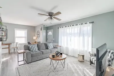 a living room with a couch and a tv at The Ranch on RaceStreet in Marion