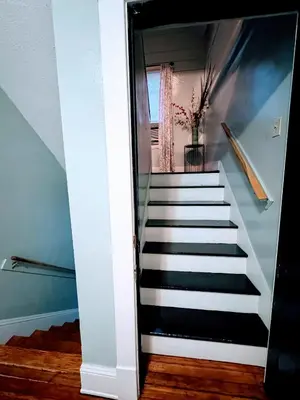a stairway leading up to a room with a vase at Cozy Home By University Circle VA,CC & Museum in Cleveland