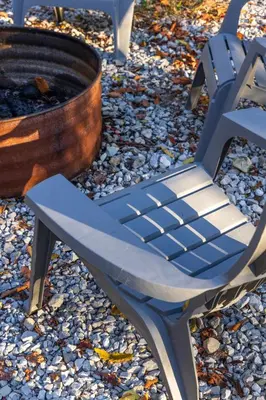 a blue chair sitting next to a fire hydrant at New listing-- Hocking Hills Modern Cabin in Logan