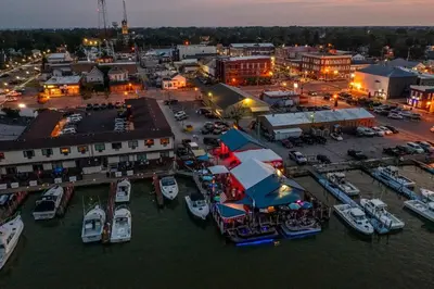 an aerial view of a marina with boats in the water at Blame Jaime - downtown, the heart of all the fun! in Port Clinton