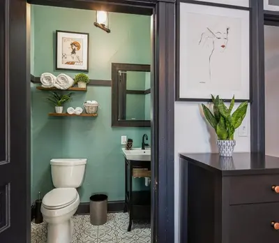 a bathroom with a toilet and a sink at Blame Jaime - downtown, the heart of all the fun! in Port Clinton