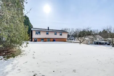 a snow covered driveway in front of a house at 3 Mi to Cuyahoga Valley NP Fairlawn Family Home! in Fairlawn