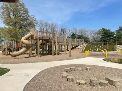 a playground with a slide in a park at Large Remodeled 4 Bedroom Only 7 Minutes to Downtown in Cleveland