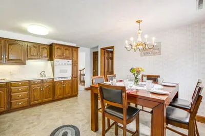 a kitchen and dining room with a table and chairs at Secluded Ohio Amish Country Getaway with Fire Pit in Sugarcreek