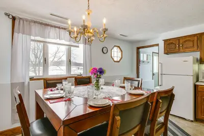 a dining room with a table and chairs at Secluded Ohio Amish Country Getaway with Fire Pit in Sugarcreek