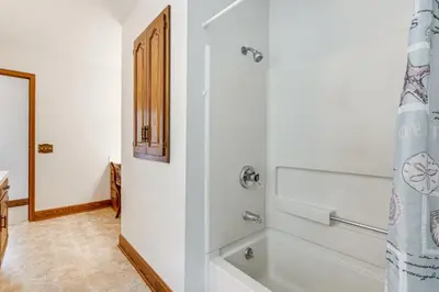 a bathroom with a bath tub and a shower at Secluded Ohio Amish Country Getaway with Fire Pit in Sugarcreek