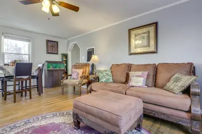 a living room with a couch and a table at 3 Mi to Englewood Dam Pet-Friendly Home with Yard! in Englewood