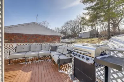 a barbecue on a deck with a couch and a grill at 3 Mi to Englewood Dam Pet-Friendly Home with Yard! in Englewood