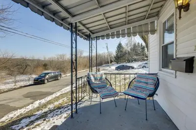 two chairs on the porch of a house at 3 Mi to Englewood Dam Pet-Friendly Home with Yard! in Englewood
