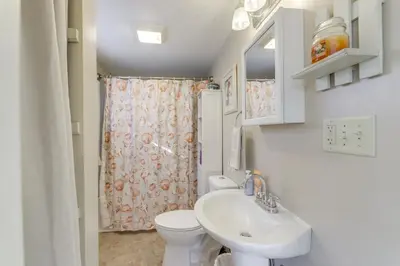 a bathroom with a toilet and a sink at 3 Mi to Englewood Dam Pet-Friendly Home with Yard! in Englewood