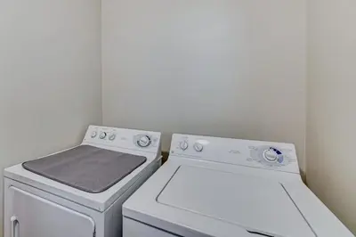 a kitchen with two white appliances and a stove at The Best of Cave Run & Morehead! in Morehead