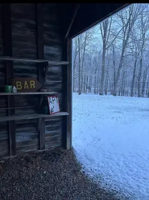 an outside view of a snow covered field with a barn at Country Getaway in Stewart