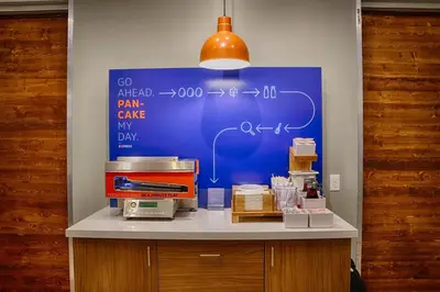 a counter with a blue board with formulas on it at Holiday Inn Express & Suites Muncie Northwest by IHG in Muncie