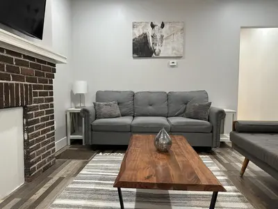 a living room with a couch and a coffee table at Cityscape 2BR Near Downtown in Columbus