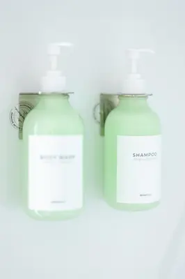 two bottles of soap on a white background at Luxury Downtown Townhome Private Garage Unit 3 in Cleveland