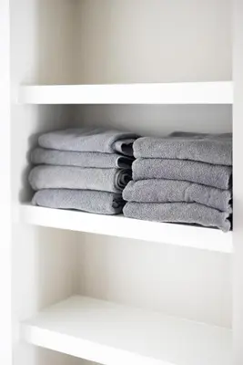 a stack of towels in a closet at Luxury Downtown Townhome Private Garage Unit 6 in Cleveland